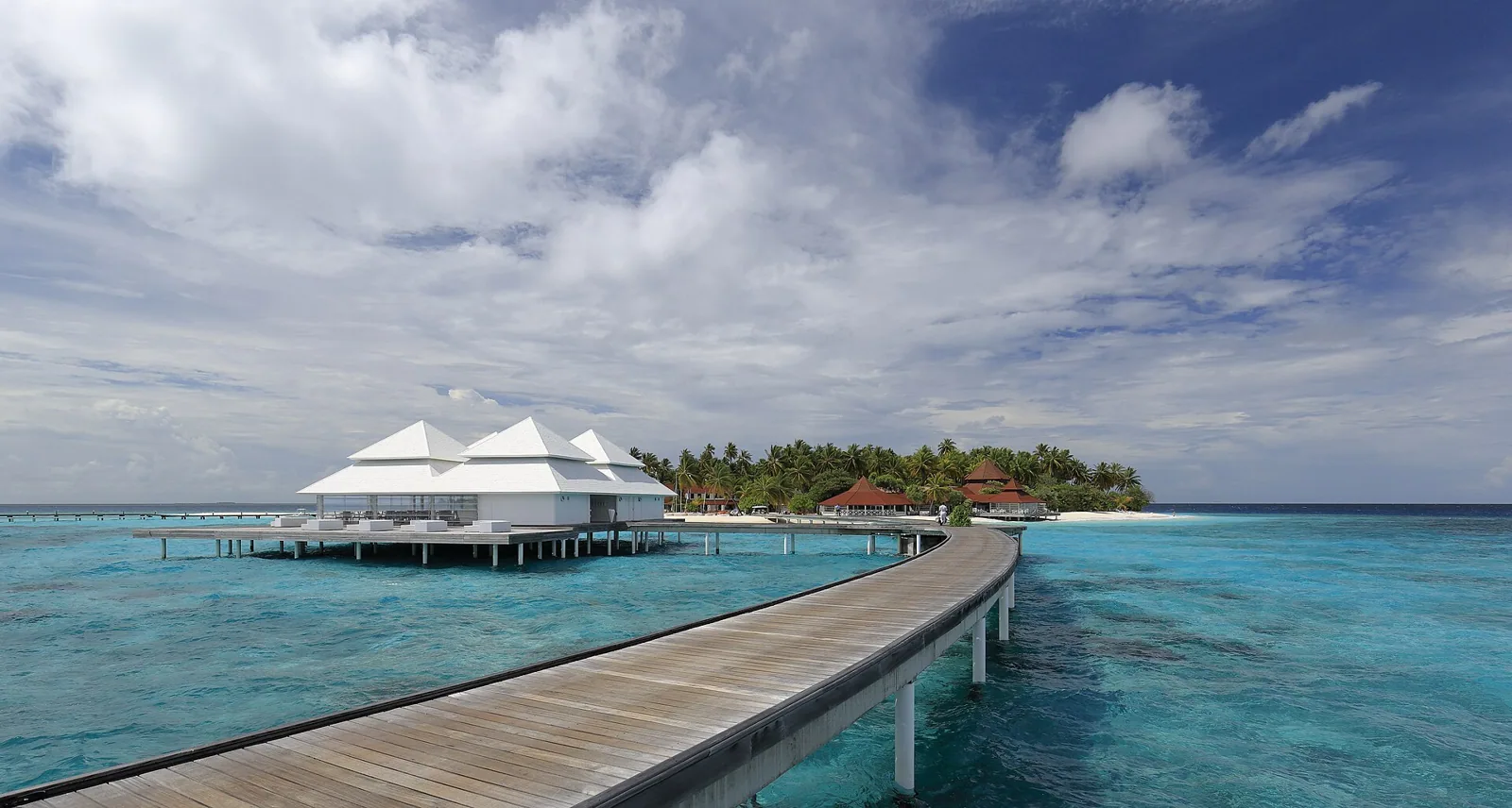 Overwater villas on a turquoise lagoon
