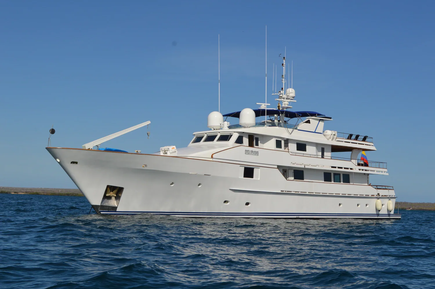 White motor superyacht on open sea