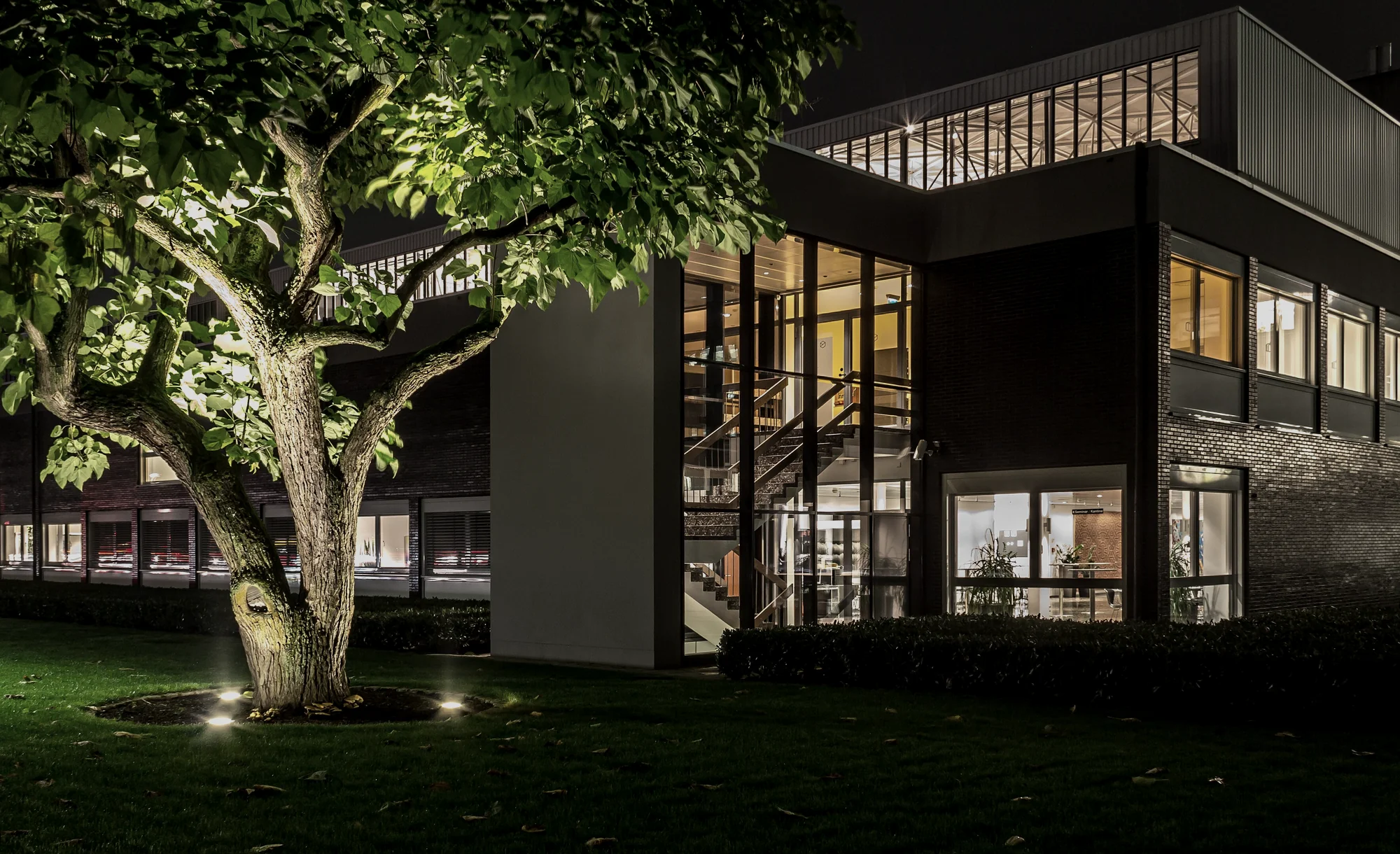 A dark contemporary residence at dusk
